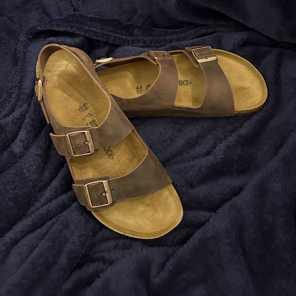 Birkenstock brown sandals with bronze buckles